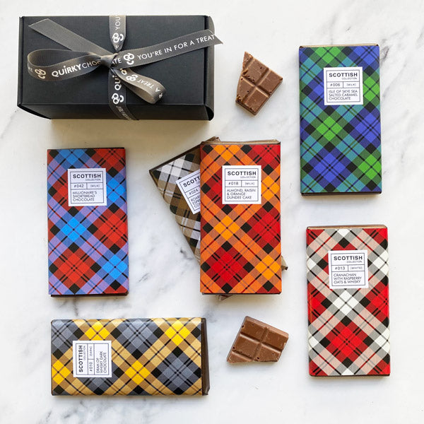 A selection of chocolate bars with different colours of tartan bar wrapping as well as our chocolate scotch eggs.