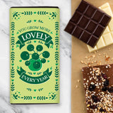 A green plant design for a chocolate bar saying 'You Grow More Lovely Every Year'