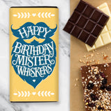 Yellow Chocolate Birthday Design with blue fluffy moustache and beard with wording saying 'Happy Birthday Mister Whiskers'