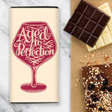 Chocolate Bar with Cream wrapper design and red wine glass with writing 'Aged to Perfection'